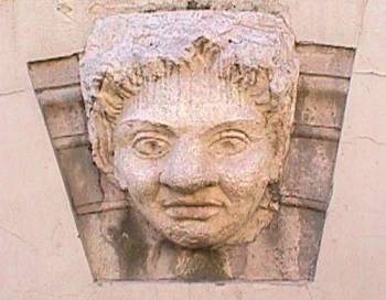 An excellent example of the reuse of things from the past. This keystone was once the center of an arch at the amphitheater in Capua Vettere. It is now being used as a decorative statue in the wall of the city's municipal building.